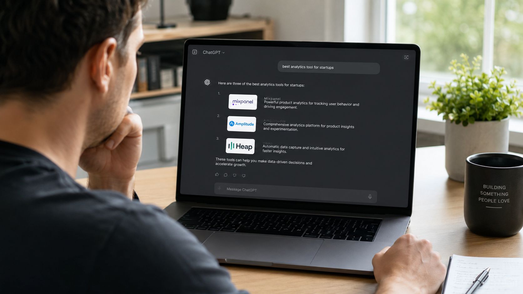 A person viewing ChatGPT search results recommending competitor analytics software tools on a laptop screen.
